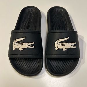 Lacoste rubber slides. Ladies 6.5.  Black and cream.
